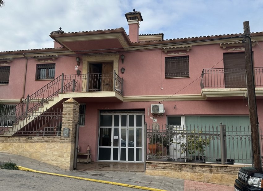 Commercial property with a showroom and parking lot in San Miguel