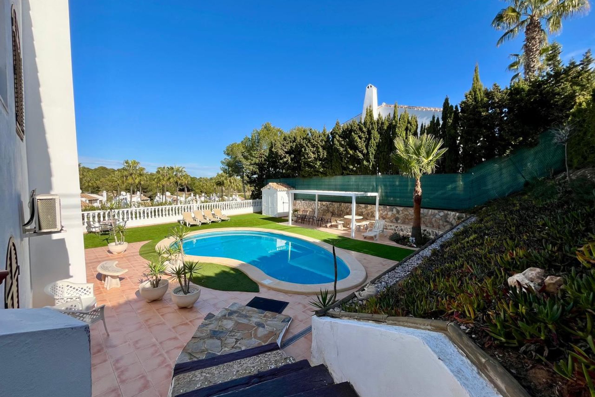Detached villa in Villamartín with a pool, golf course views, and 4 bedrooms