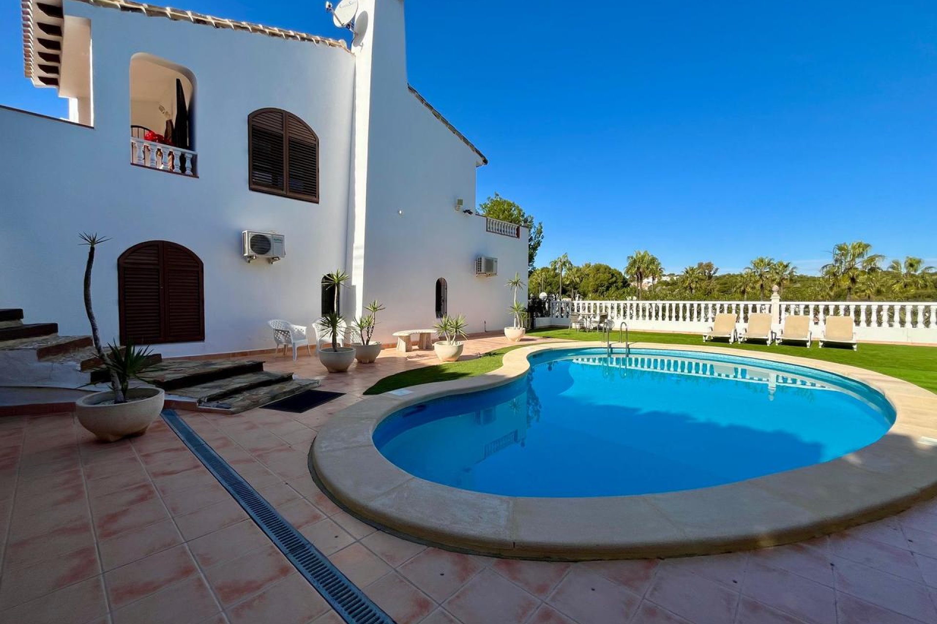 Detached villa in Villamartín with a pool, golf course views, and 4 bedrooms