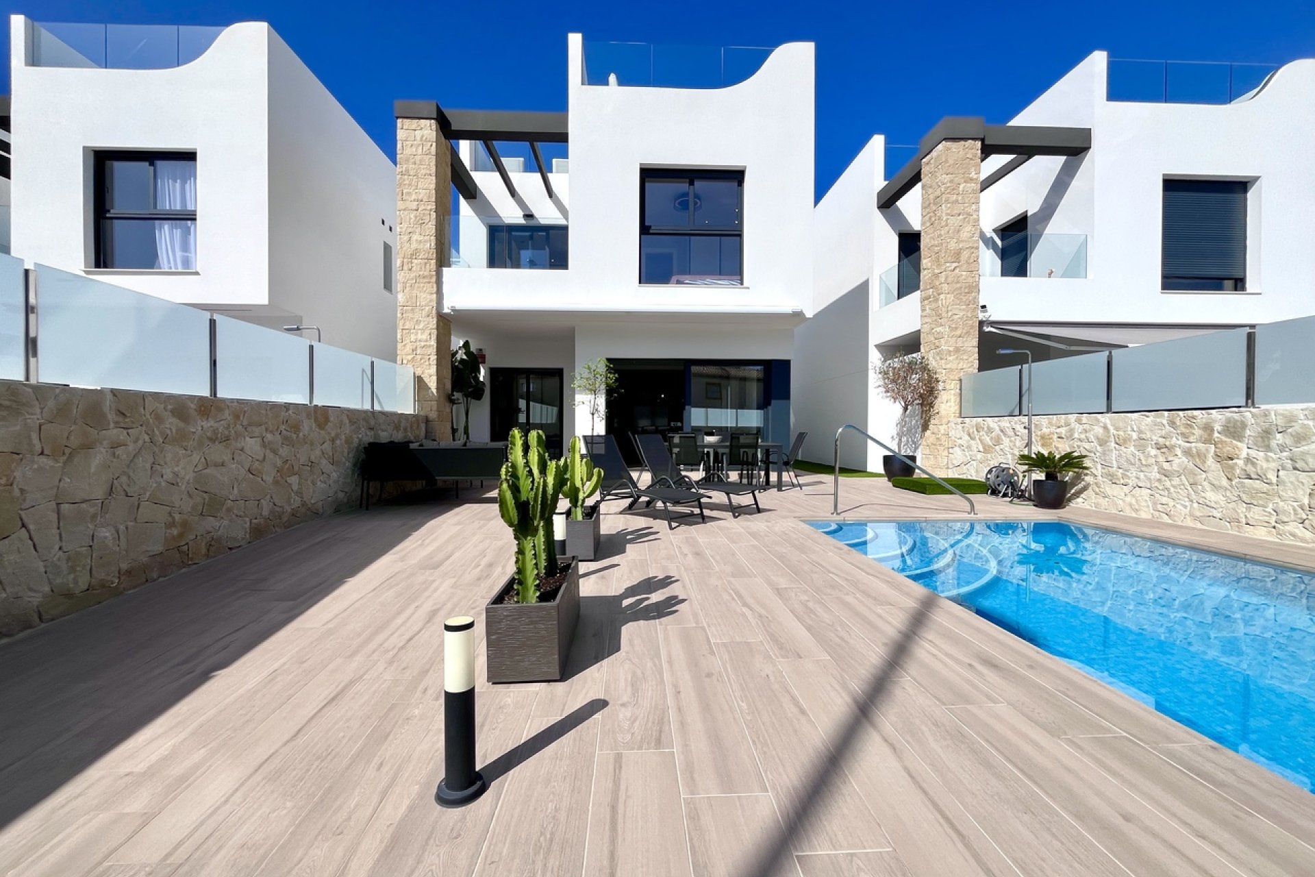 Modern villa in Punta Prima with a private pool and rooftop terrace